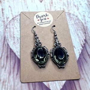 Large sage green crystal in silver metal earrings